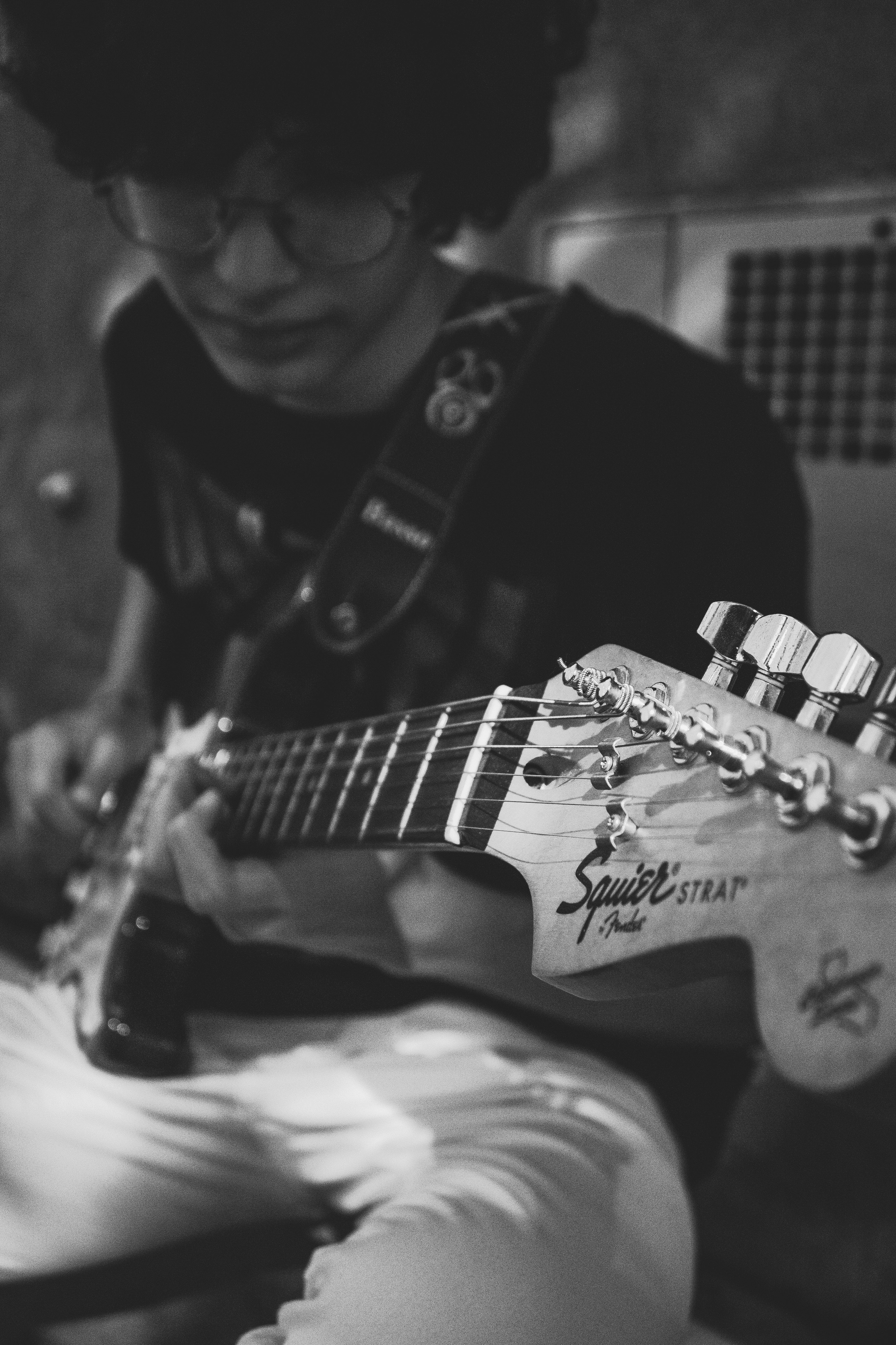 black and white photo of young guitarist